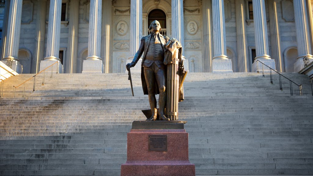 South Carolina State House featuring a statue or sculpture, an administrative buidling and a sunset