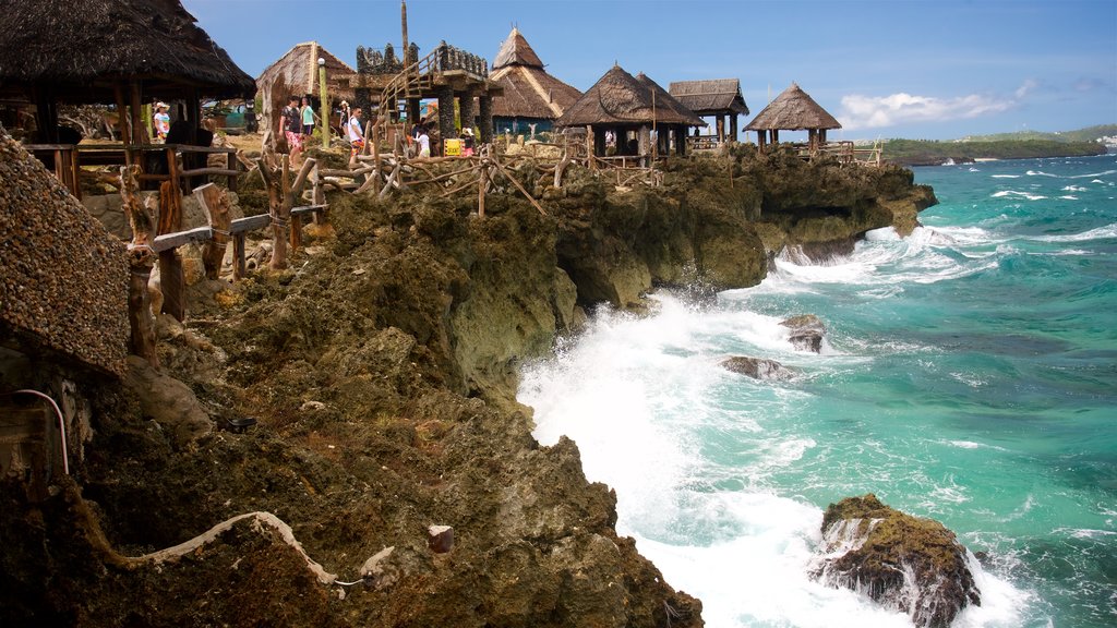 Crystal Cove Island showing island views, rocky coastline and a coastal town