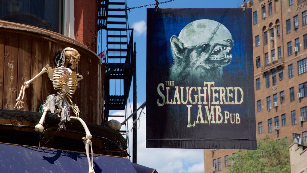 Greenwich Village showing a bar and signage