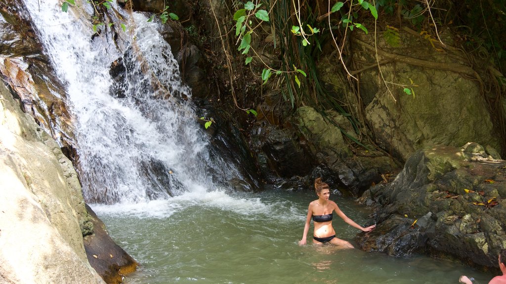 Namuang Waterfall featuring a river or creek and a waterfall as well as an individual femail