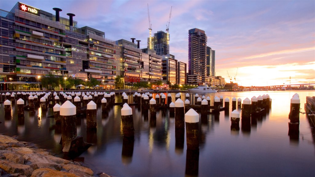 Victoria featuring a sunset, a bay or harbor and a skyscraper