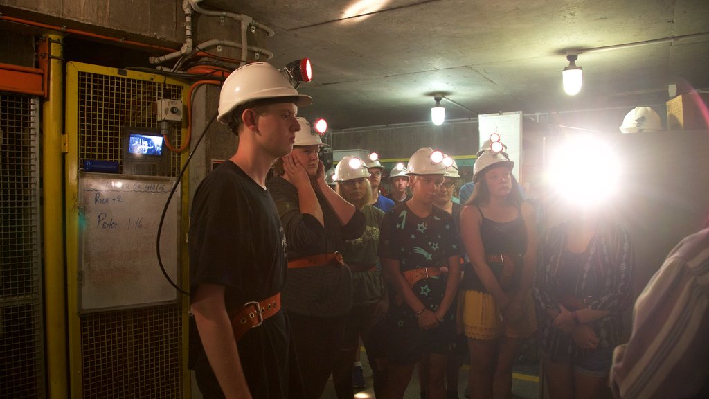 Central Deborah Gold Mine showing interior views as well as a small group of people