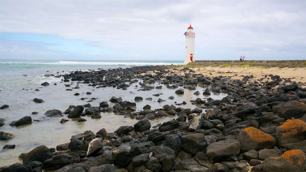 Griffiths Island Lighthouse showing a lighthouse, rugged coastline and waves