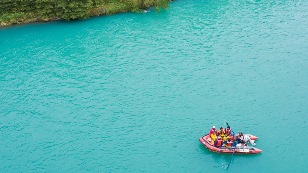 Kenai Peninsula featuring a lake or waterhole and rafting as well as a small group of people