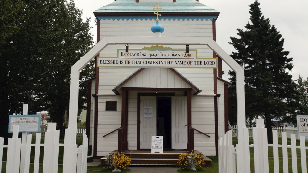 Kenai showing a church or cathedral and signage