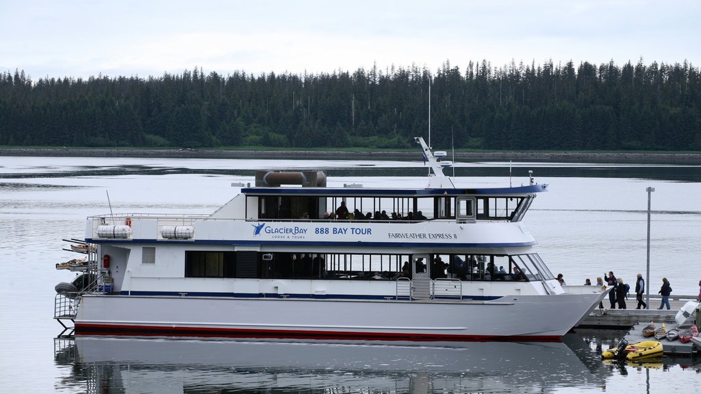 Glacier Bay National Park showing a bay or harbour, a ferry and forest scenes