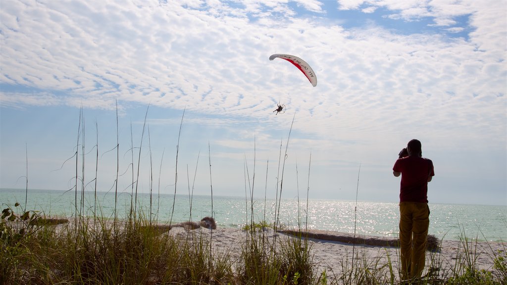 Barefoot Beach which includes a sandy beach, a bay or harbour and skydiving