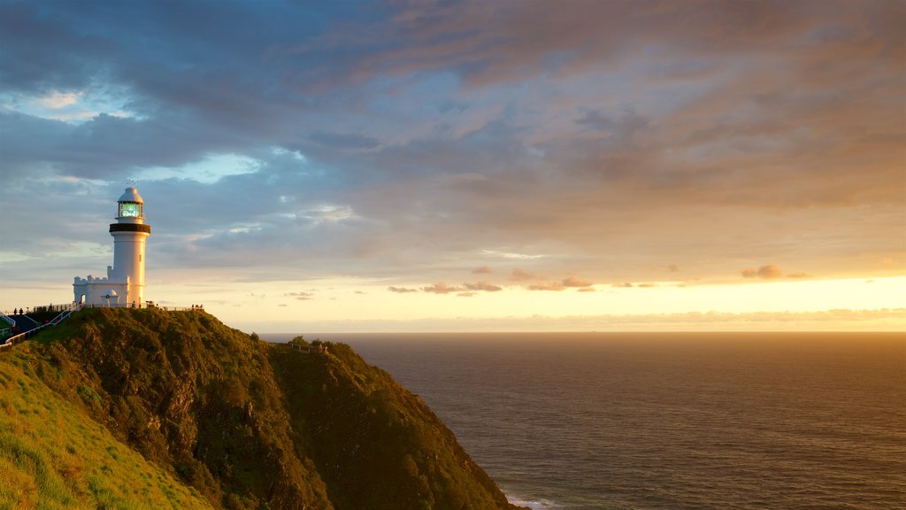 Cape Byron Lighthouse featuring a lighthouse and a sunset