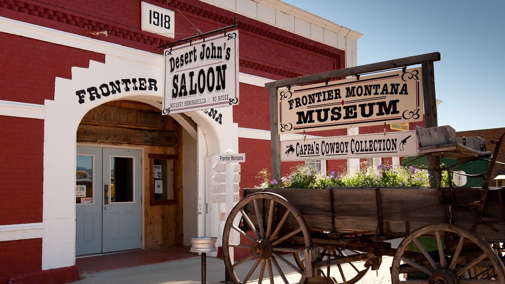 Deer Lodge featuring signage