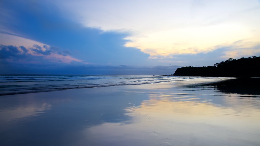 Pebbly Beach which includes a sandy beach, general coastal views and a sunset