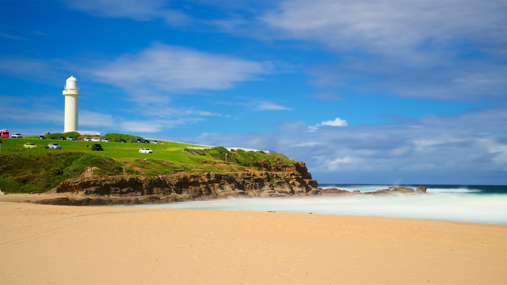 Wollongong South Beach which includes a sandy beach, a lighthouse and general coastal views