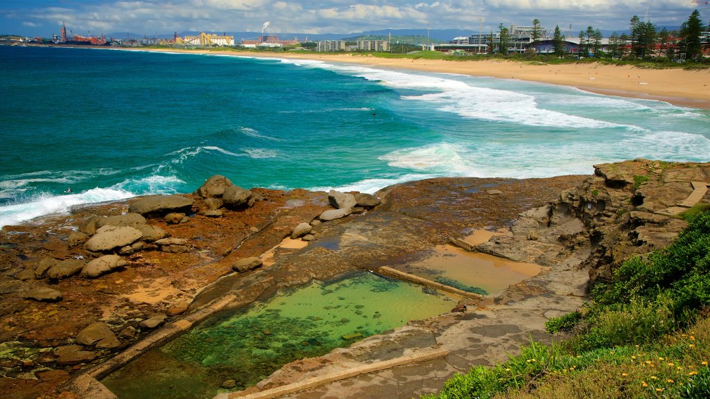 Wollongong South Beach which includes rugged coastline and a sandy beach