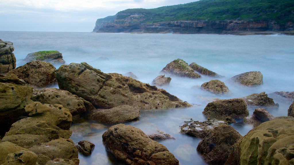 Sanctuary Point featuring rugged coastline, a bay or harbour and waves