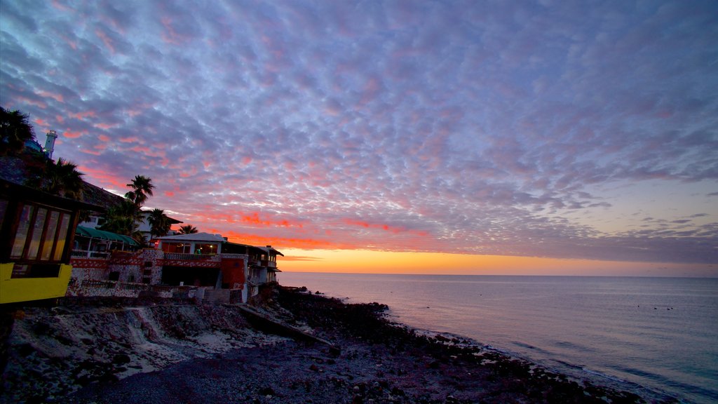 Mexico showing a sunset, a bay or harbour and a coastal town