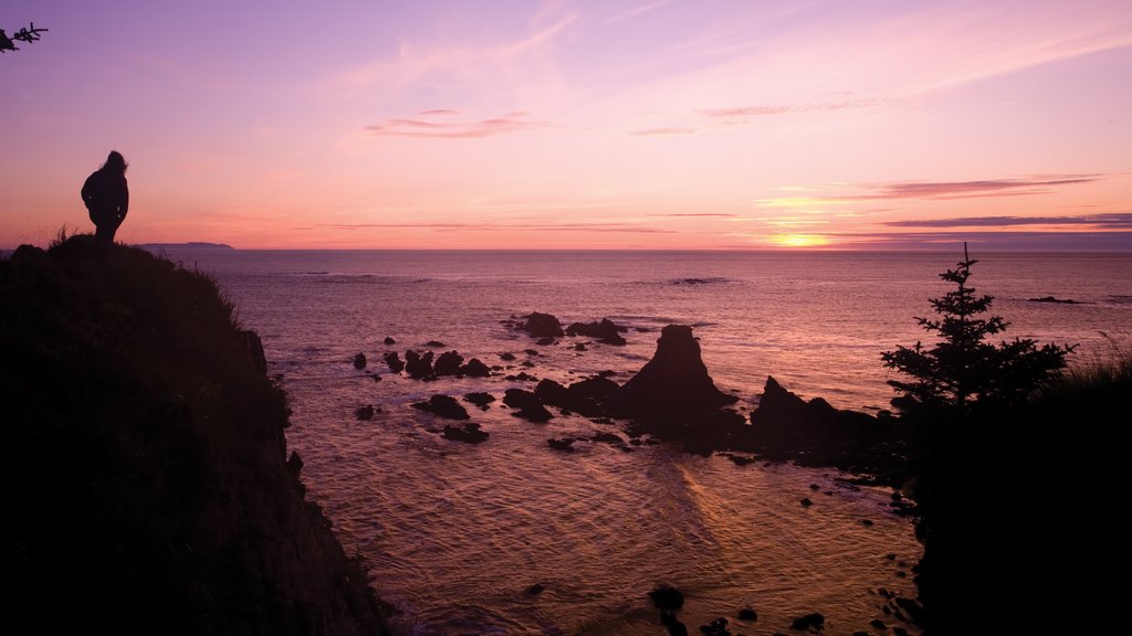 Kodiak Island showing a sunset, a lake or waterhole and mountains