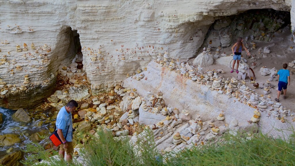 Escalier du Roi d\'Aragon showing rocky coastline as well as a family