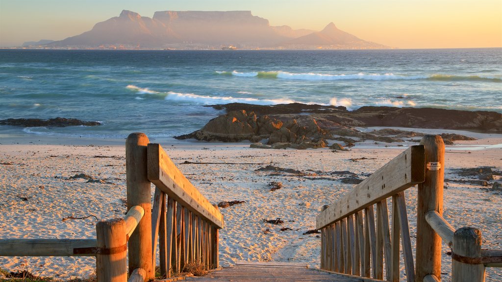 Bloubergstrand featuring mountains, a sandy beach and a sunset