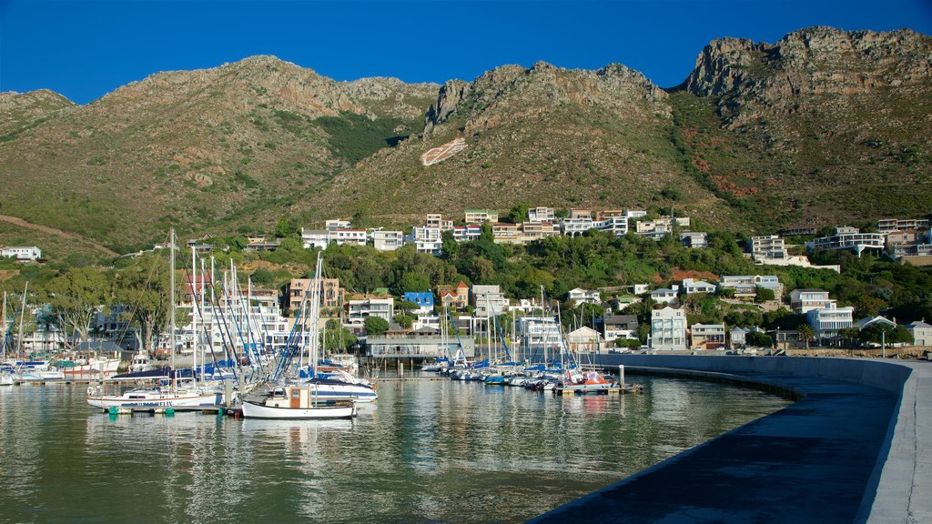 Gordon\'s Bay which includes a coastal town, mountains and a bay or harbor