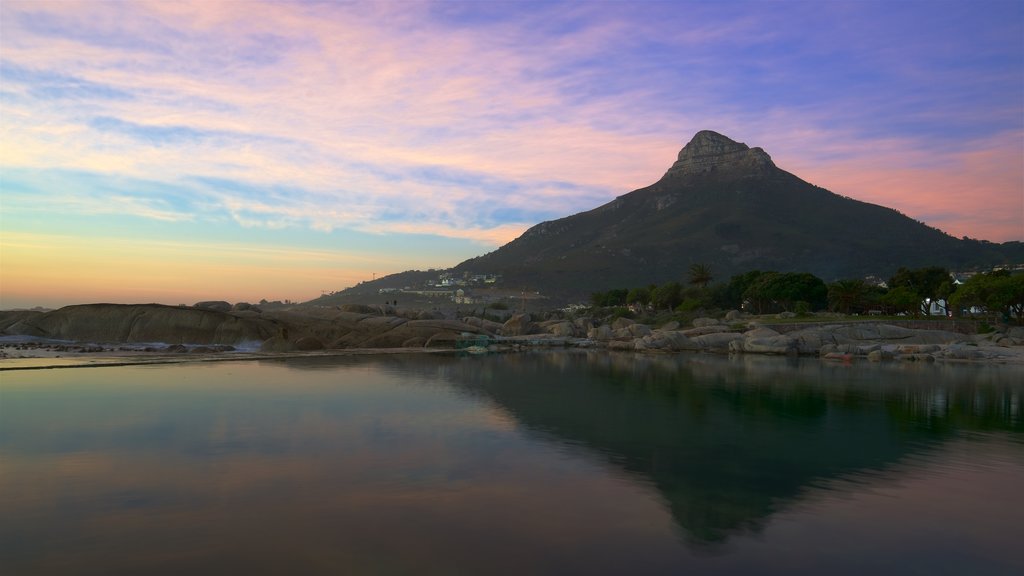 Camps Bay Beach showing a beach and a sunset