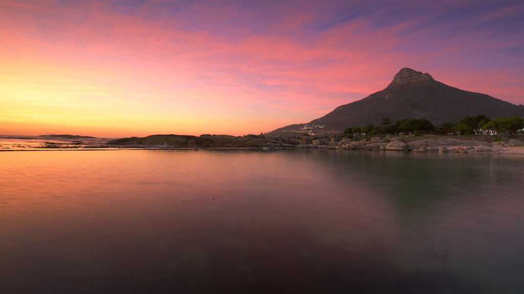 Camps Bay Beach showing a sandy beach and a sunset