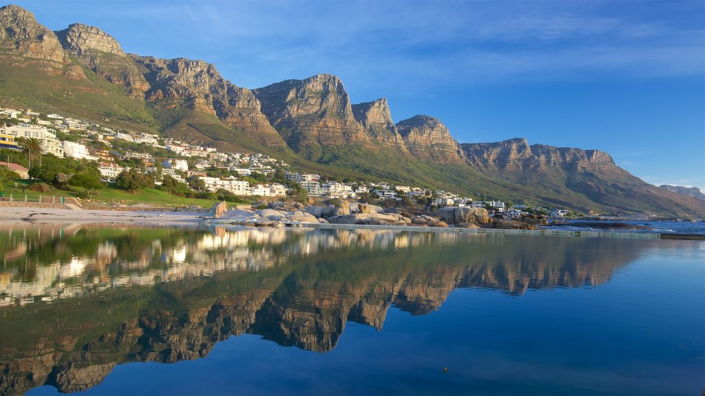 Camps Bay Beach showing a sandy beach and rugged coastline