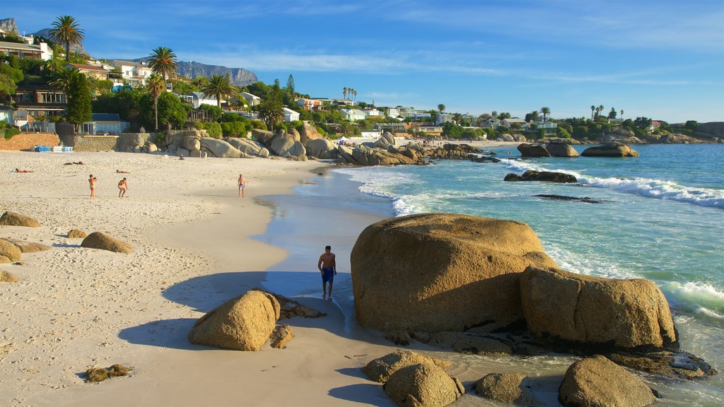 Clifton Bay Beach showing a sandy beach, a coastal town and rugged coastline