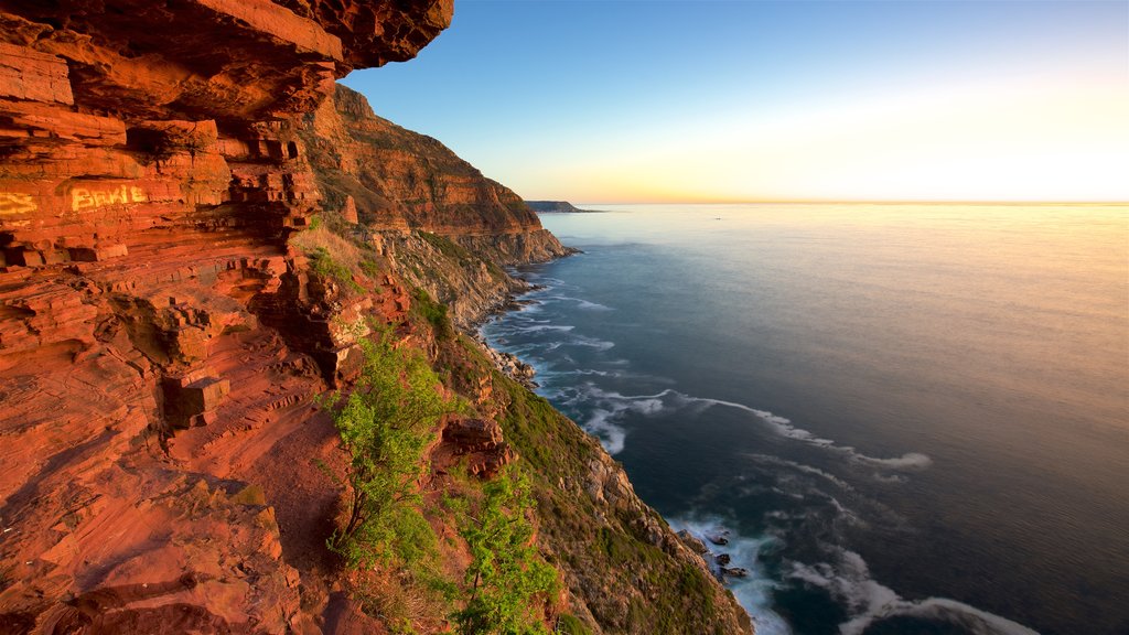 Chapmans Peak which includes a sunset and rugged coastline