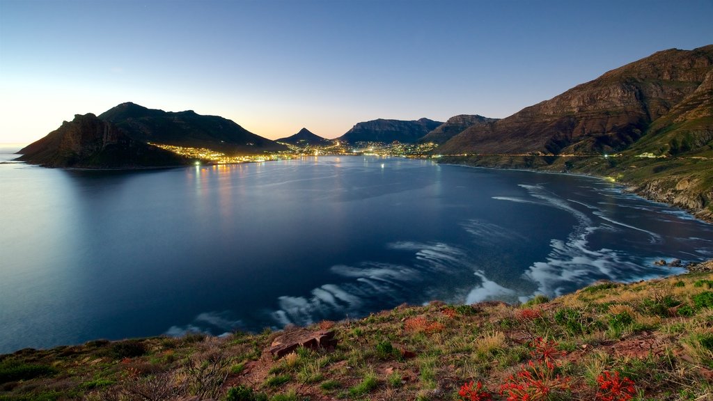 Chapmans Peak which includes a sunset and rocky coastline