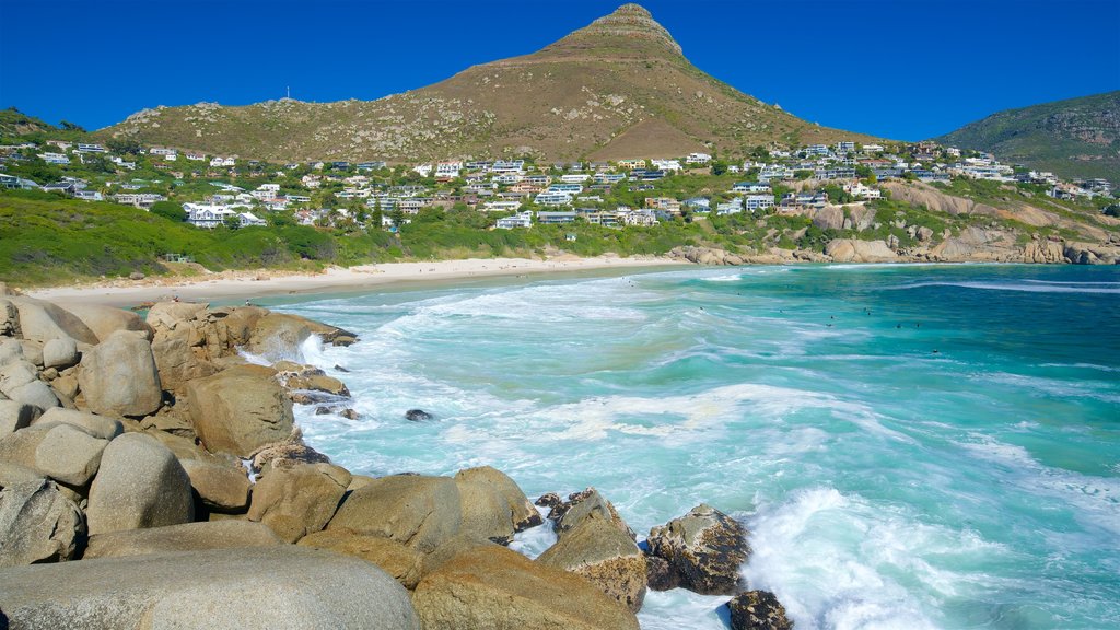 Llandudno Beach showing a beach, waves and rugged coastline