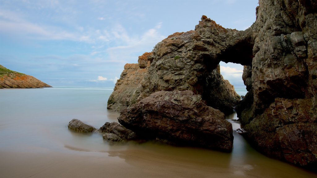 Arch Rock which includes rugged coastline