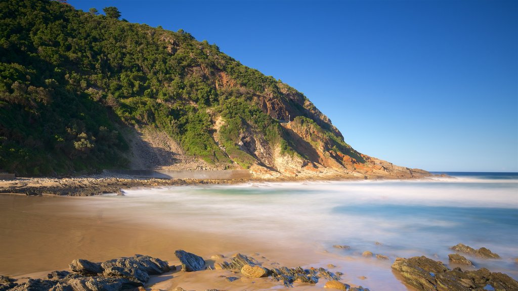 Victoria Bay Beach featuring rugged coastline, landscape views and a sandy beach