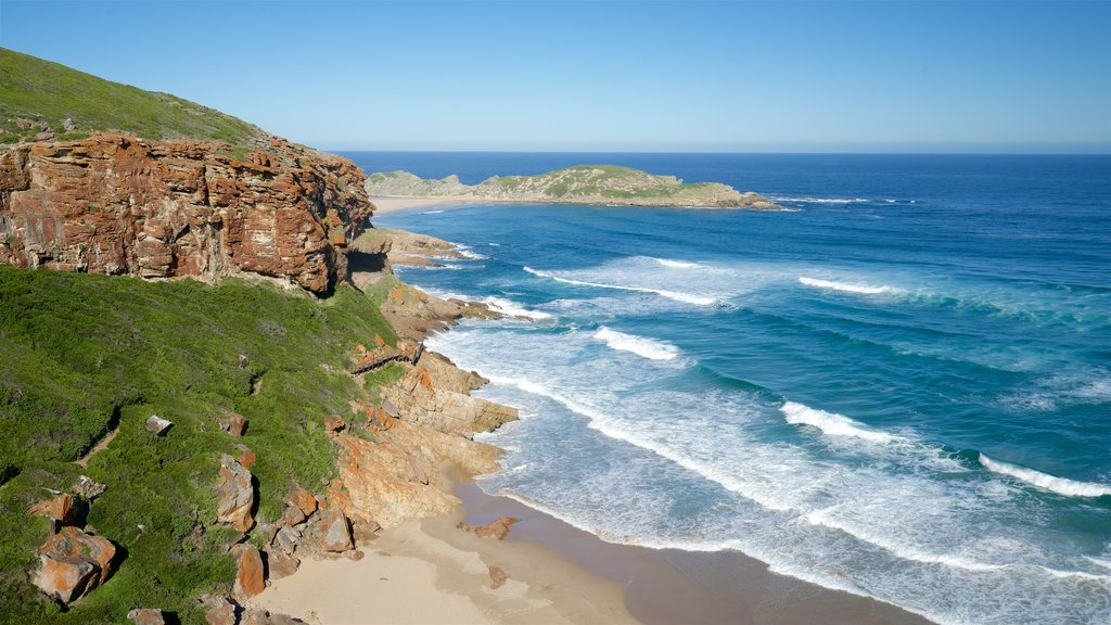 Plettenberg Bay showing rocky coastline, a sandy beach and landscape views