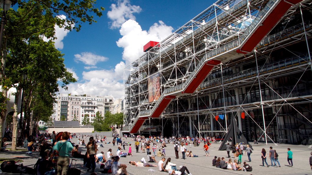 Museum Georges Pompidou which includes a city and a square or plaza as well as a large group of people