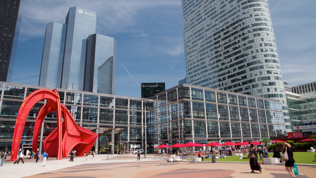 La Defense which includes modern architecture, art and a square or plaza