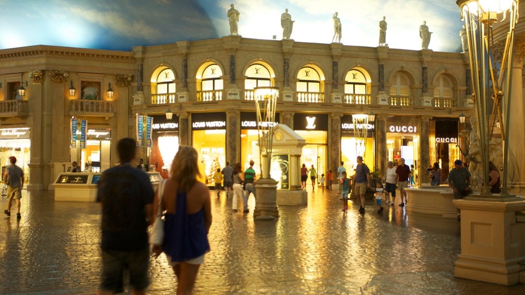 Forum Shops which includes shopping, a city and interior views