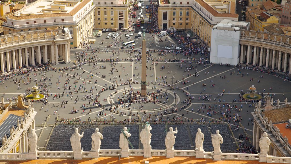 Piazza San Pietro which includes a square or plaza, a statue or sculpture and a city