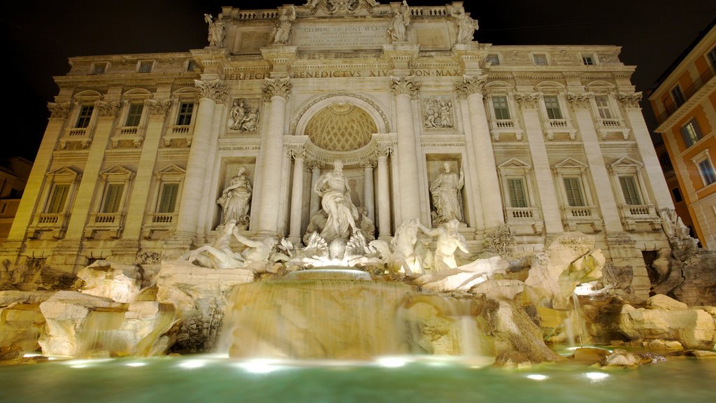 Fontana di Trevi mostrando una plaza, un castillo y una estatua o escultura