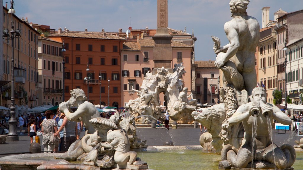 Piazza Navona showing art, a monument and a statue or sculpture