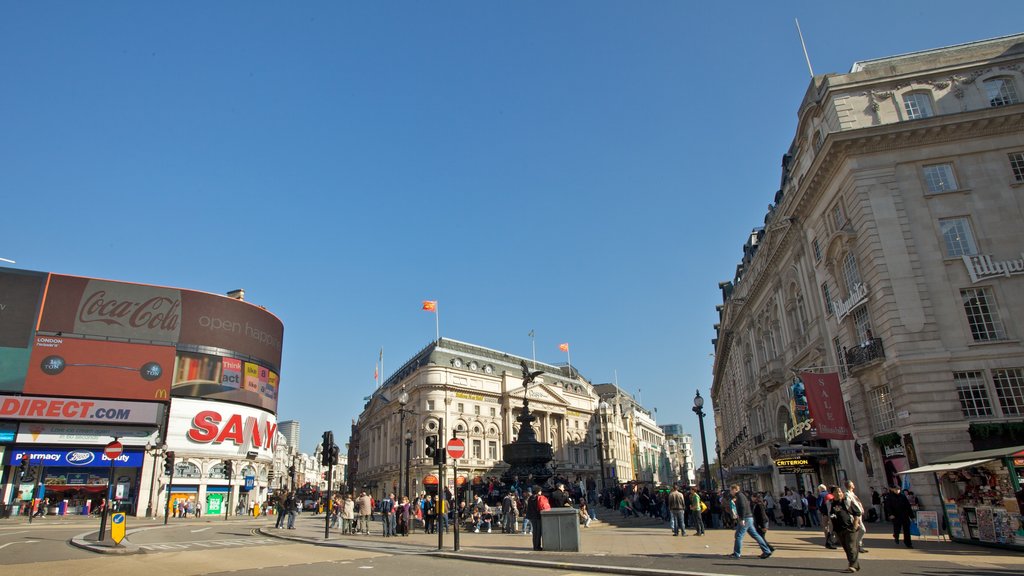 Piccadilly Circus featuring a city