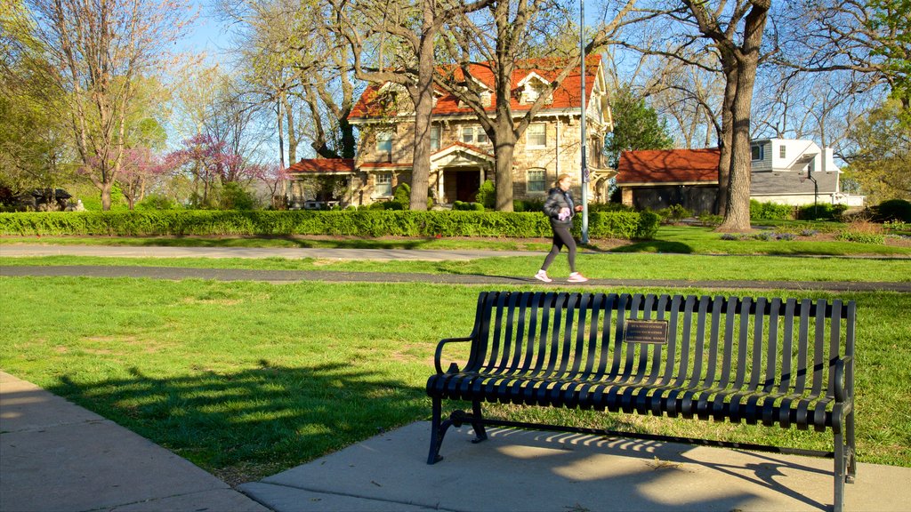 Loose Park which includes a garden and hiking or walking as well as an individual female