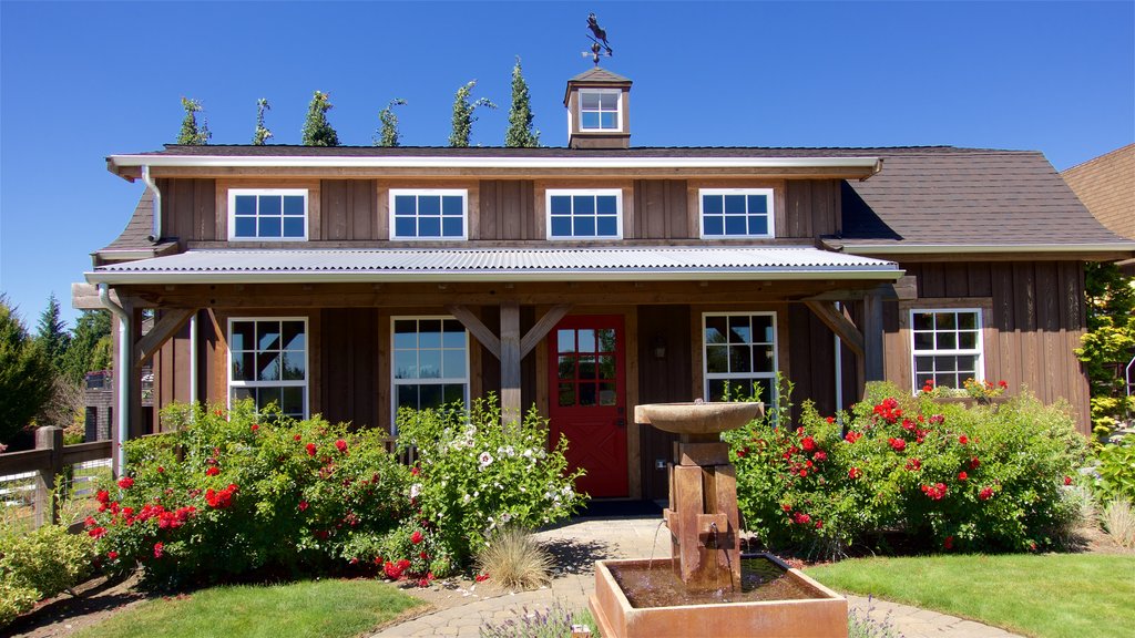 Woodinville featuring wildflowers, a fountain and a house