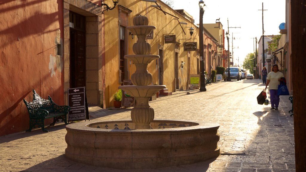 Huichapan que incluye una fuente y un atardecer