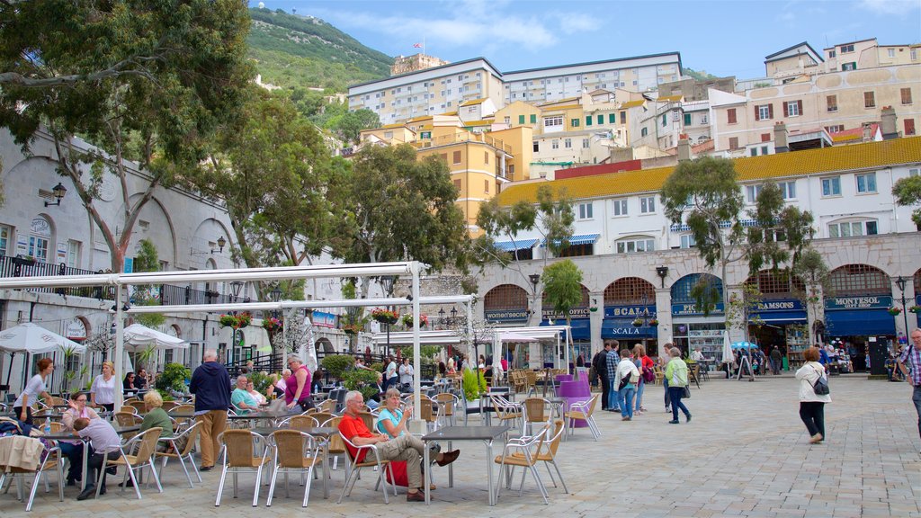 Casemates Square showing a square or plaza as well as a small group of people