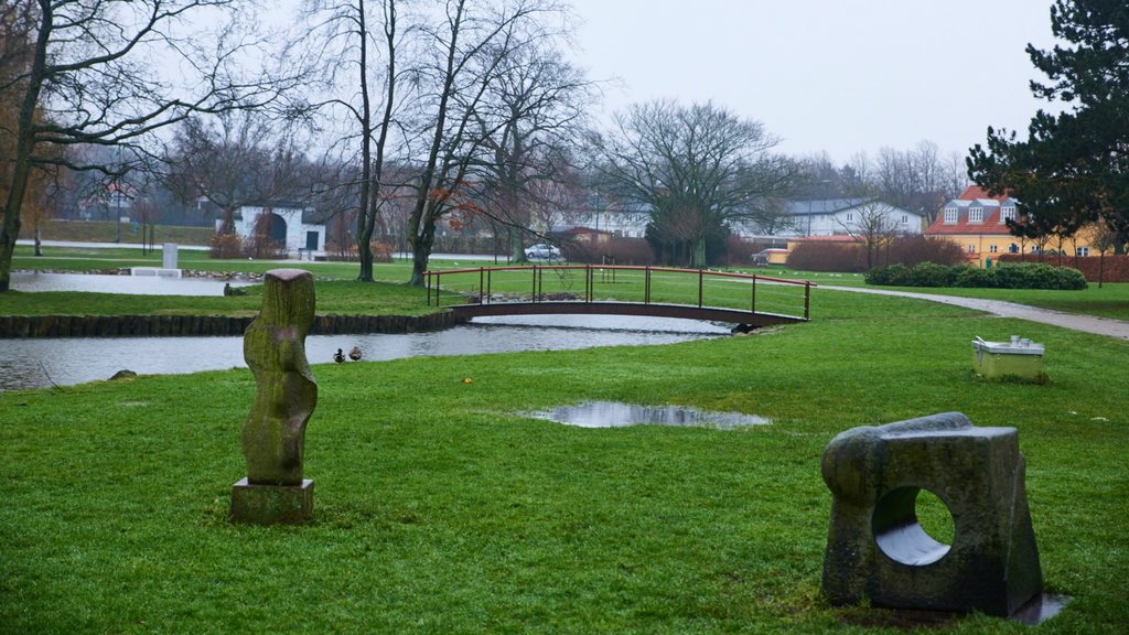 Slagelse which includes a park, a bridge and outdoor art