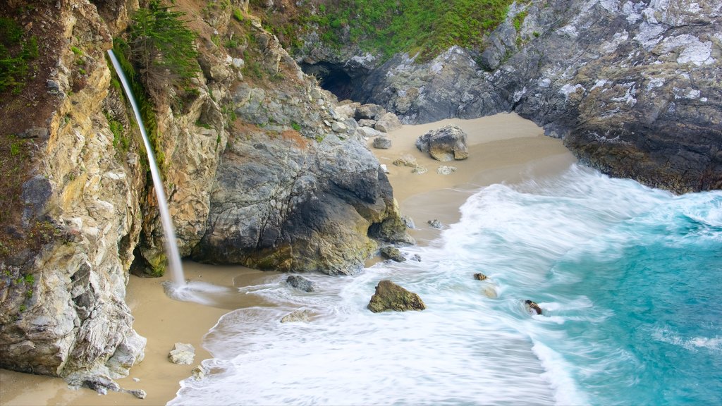 McWay Falls showing a beach and rugged coastline