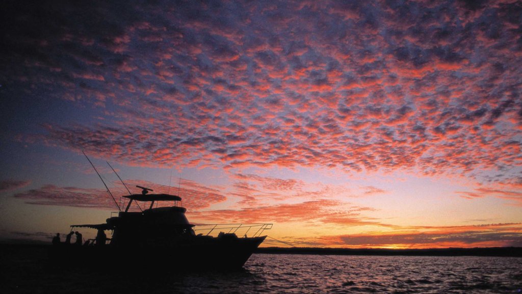 Coral Coast which includes boating and a sunset