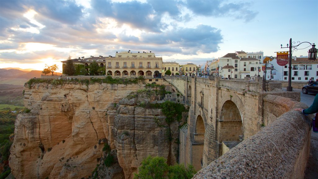 Puente Nuevo which includes a small town or village and a gorge or canyon