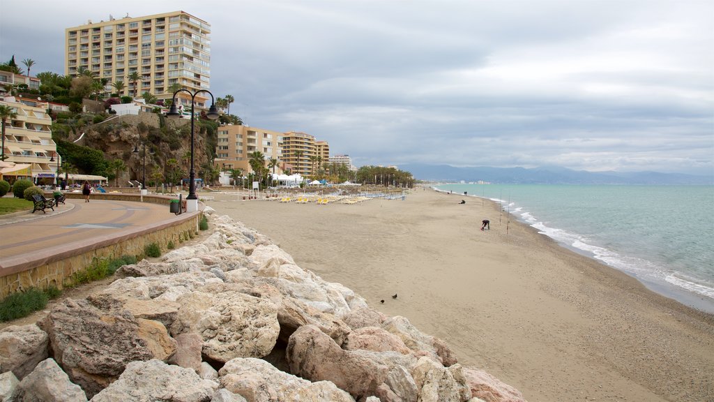 Torremolinos showing a beach and a coastal town