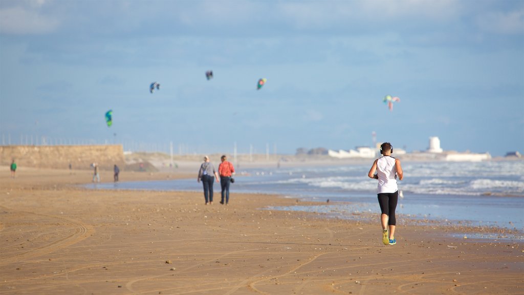 Victoria Beach which includes a sandy beach as well as a small group of people