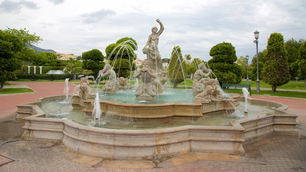 La Bateria Park featuring a garden, a statue or sculpture and a fountain